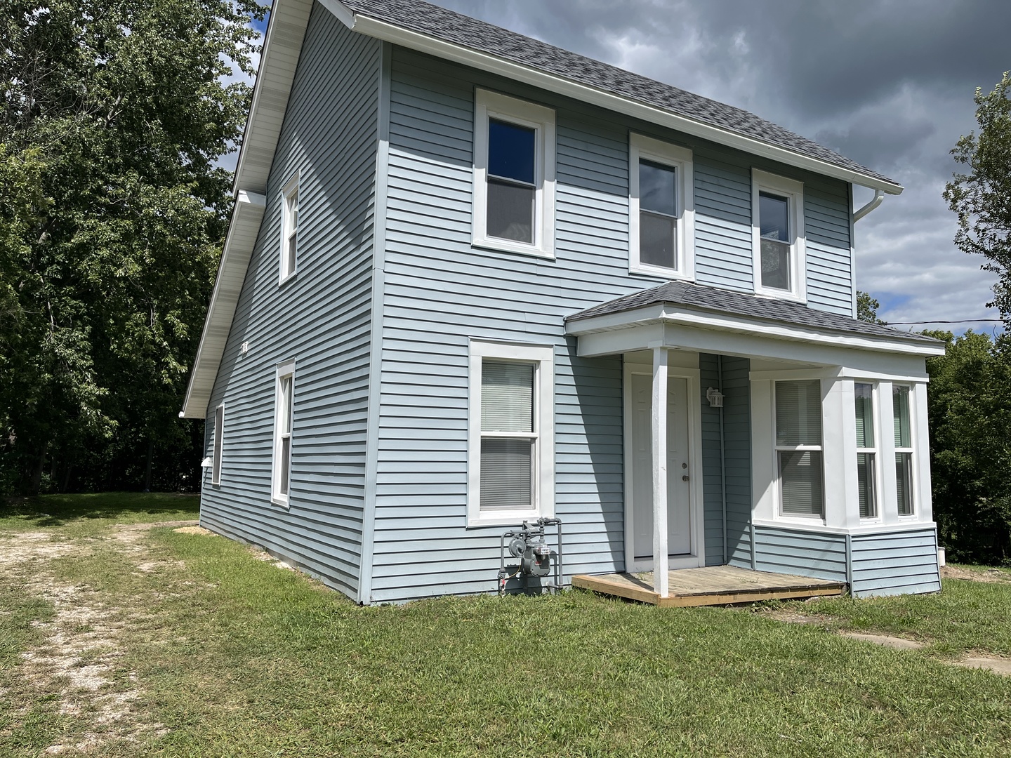 a front view of a house with a yard
