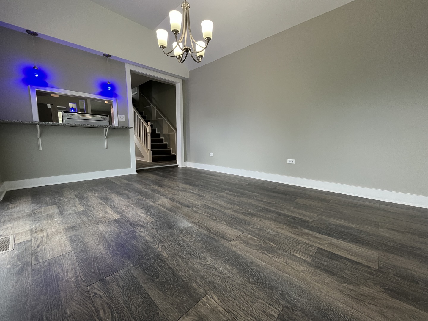 2625 North 3653rd Road Sheridan, IL 60551 - Photo 13 of 25 a view of a livingroom with hardwood floor and a ceiling fan