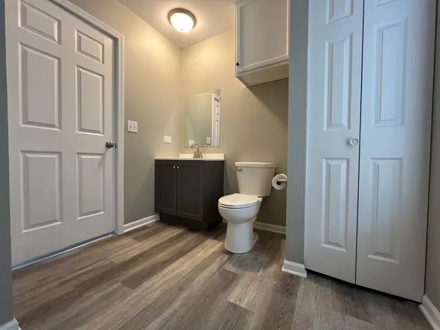 a spacious bathroom with a toilet