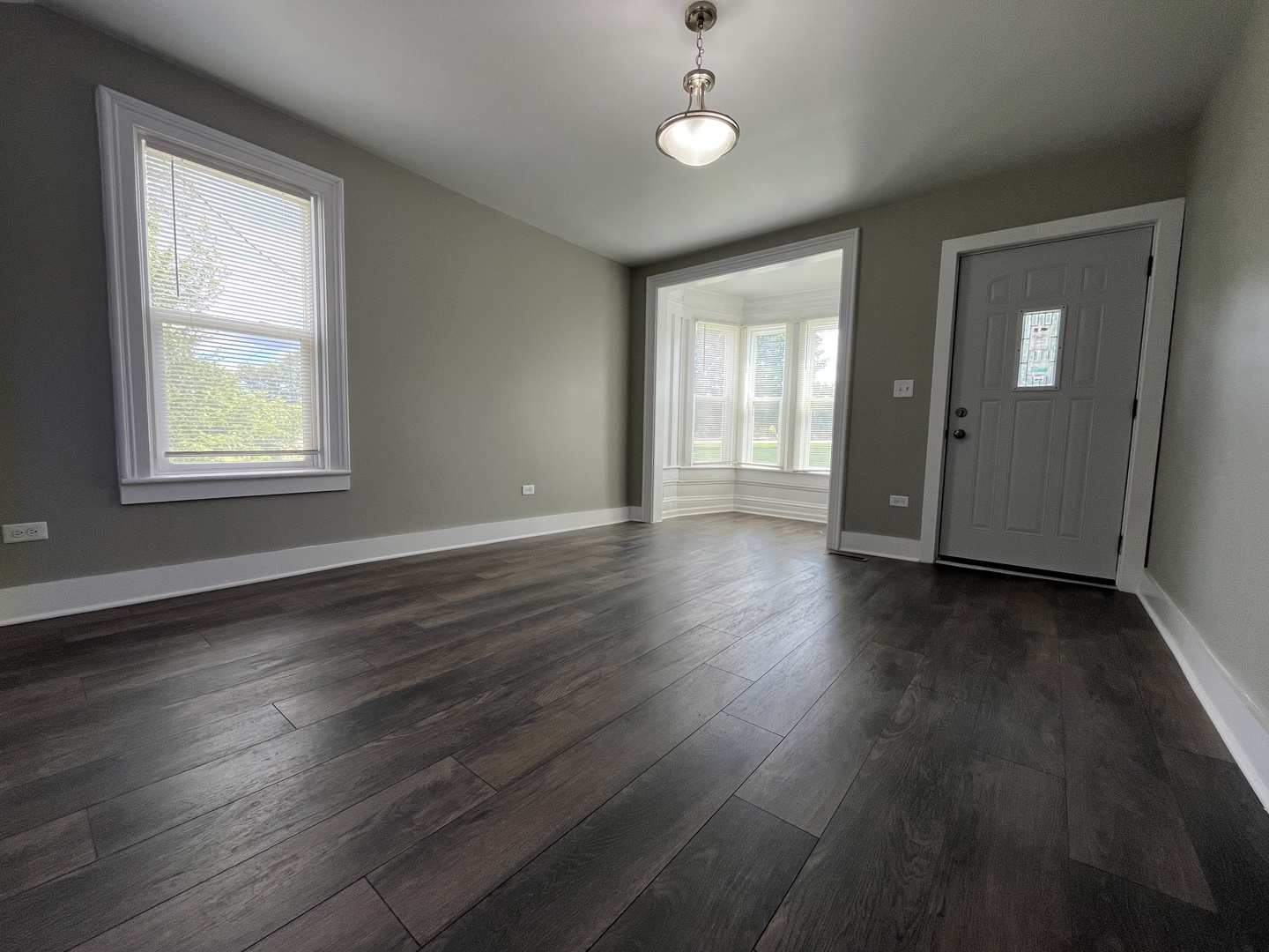 2625 North 3653rd Road Sheridan, IL 60551 - Photo 2 of 25 an empty room with wooden floor and windows