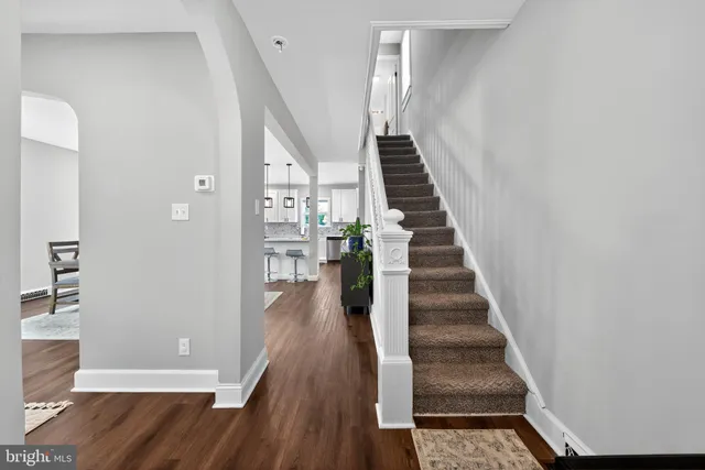a view of entryway with wooden floor
