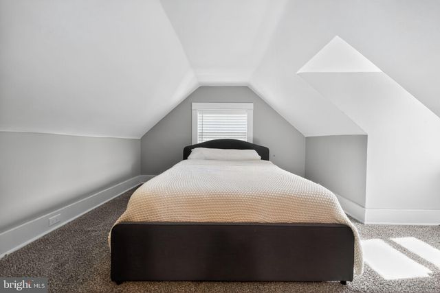 a bedroom with a bed and closet