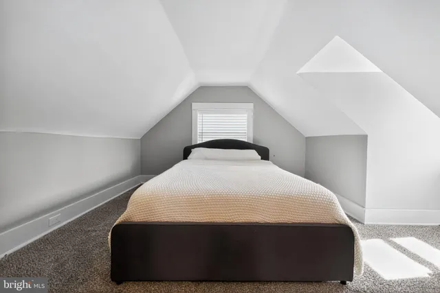 a bedroom with a bed and closet