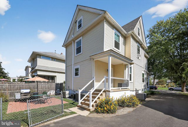 a view of a building with a street