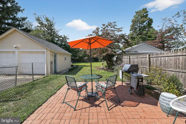 a view of a backyard with sitting area