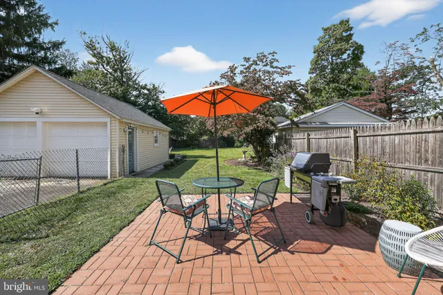 a view of a backyard with sitting area