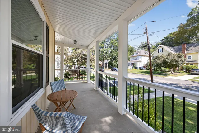 a view of a chair and tables in the balcony