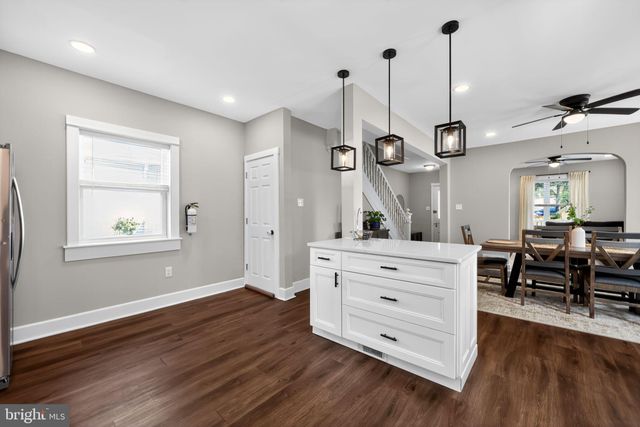 a view of a room with cabinet and wooden floor