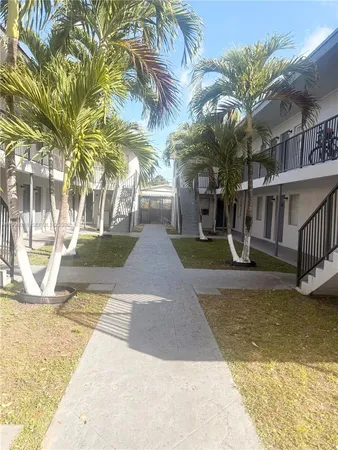 a view of a house with basketball court