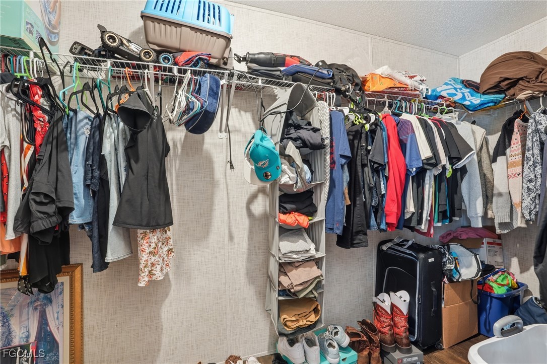 2491 Farrance Court North Fort Myers, FL 33917 - Photo 18 of 26 a view of walk in closet with clothes