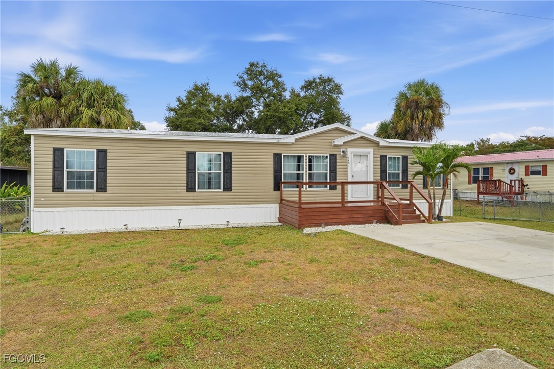 2491 Farrance Court North Fort Myers, FL 33917 - Photo 2 of 26 a front view of a house with a yard