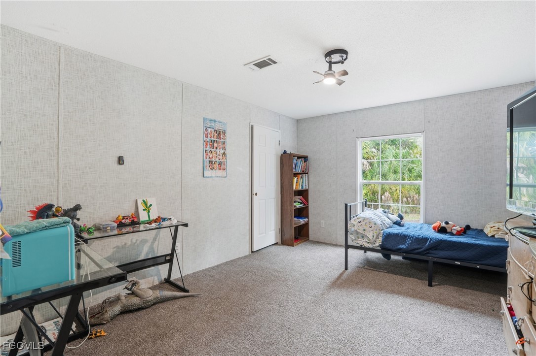 2491 Farrance Court North Fort Myers, FL 33917 - Photo 21 of 26 a livingroom with workspace and a window