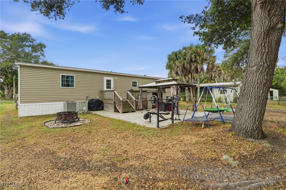 2491 Farrance Court North Fort Myers, FL 33917 - Photo 25 of 26 a view of a house with backyard and sitting area