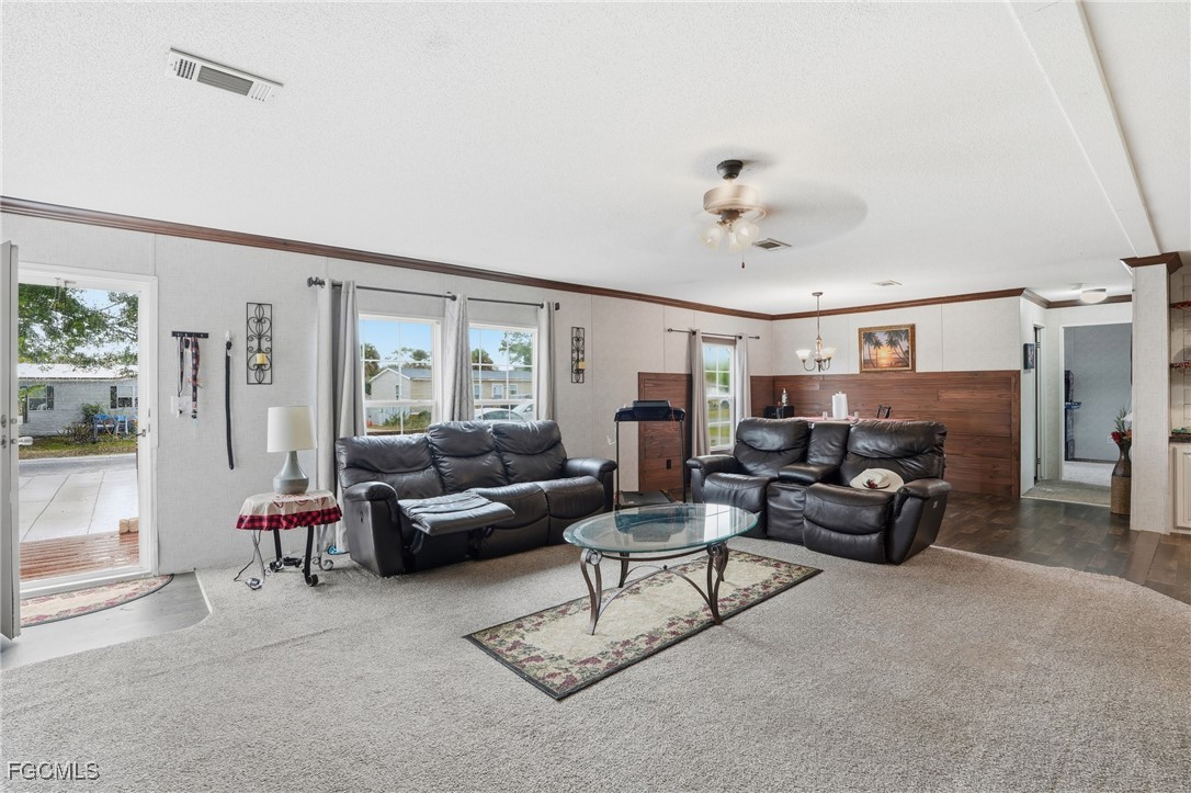 2491 Farrance Court North Fort Myers, FL 33917 - Photo 4 of 26 a living room with furniture and a fireplace