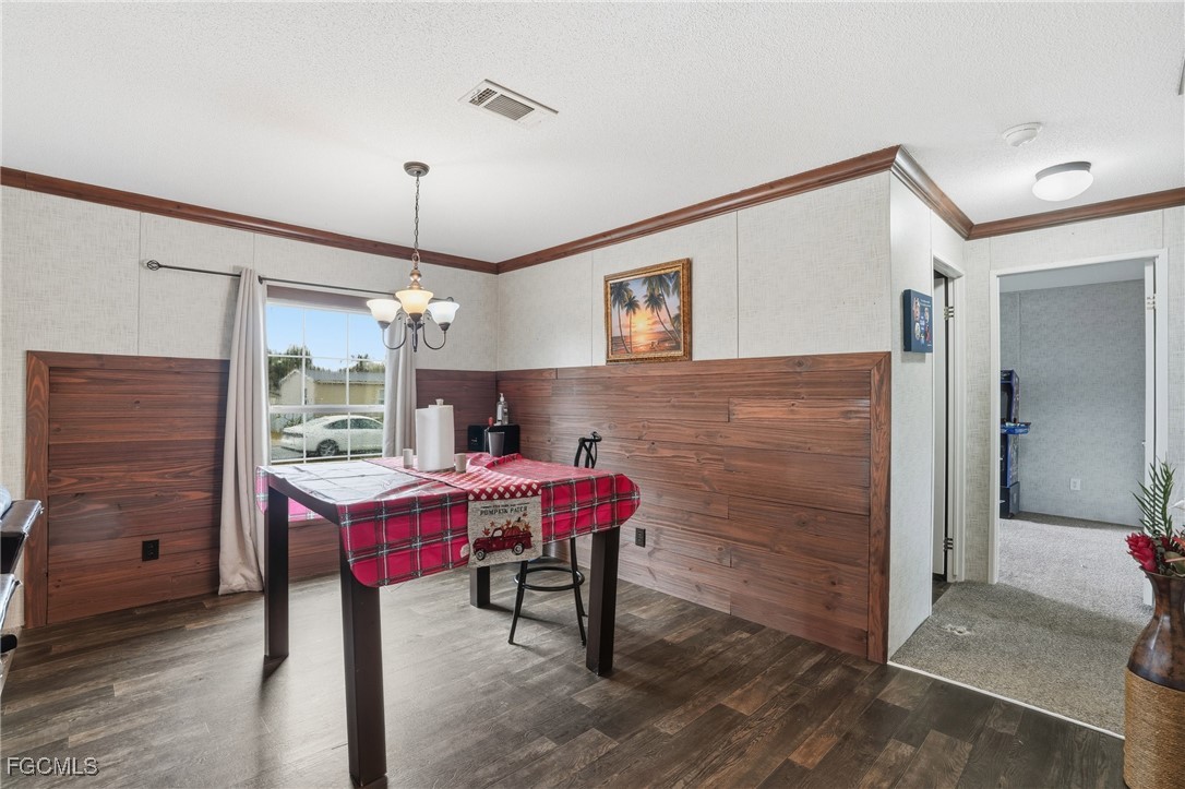 2491 Farrance Court North Fort Myers, FL 33917 - Photo 7 of 26 a view of a dining room with furniture and wooden floor