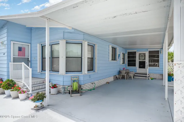 a view of a balcony with furniture