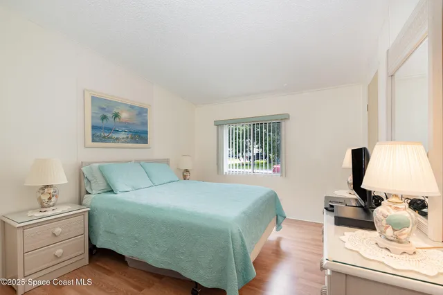 a bedroom with a bed and a cabinets