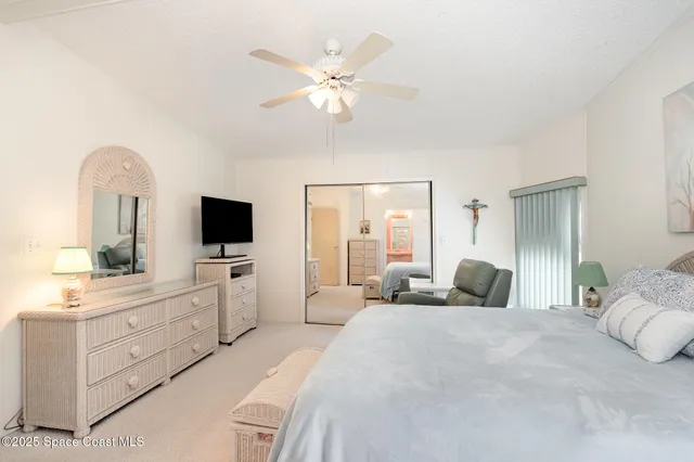 a bathroom with a sink a toilet a mirror a vanity and shower