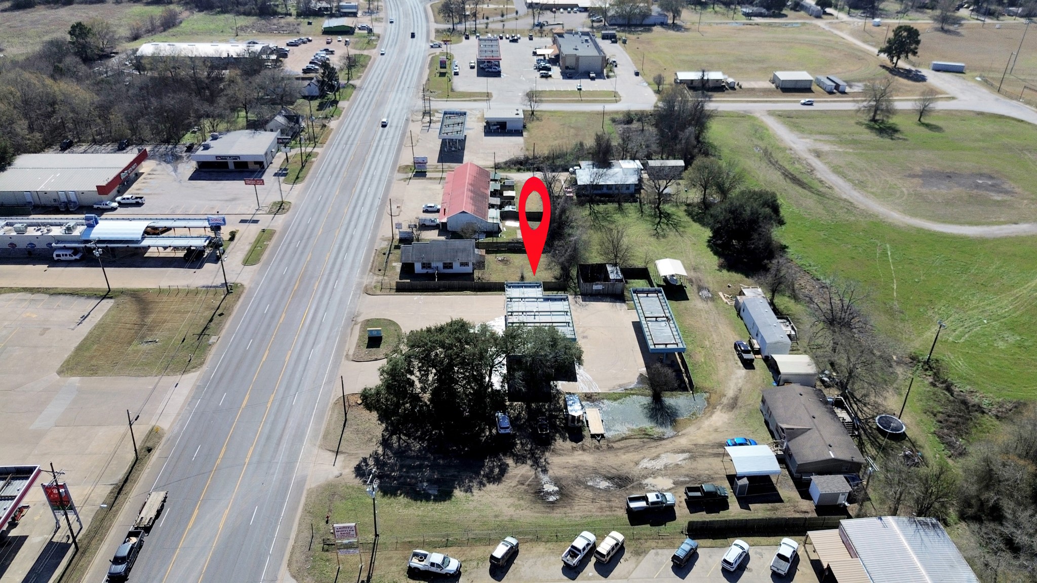 452 South Robb Street Trinity, TX 75862 - Photo 6 of 8 an aerial view of multiple houses with yard