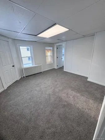 a kitchen with stainless steel appliances granite countertop a sink a microwave a refrigerator and a stove