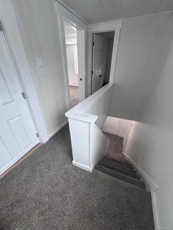 a kitchen with a refrigerator and a stove