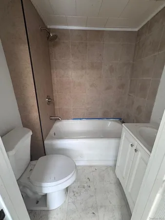 a view of a hallway to a bedroom