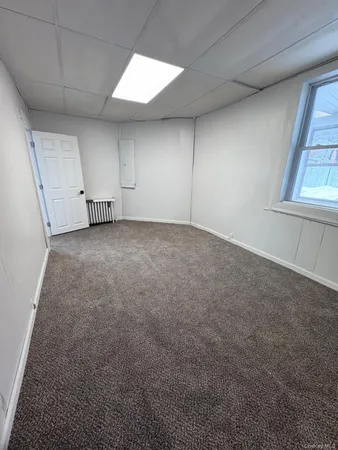 a view of empty room with windows