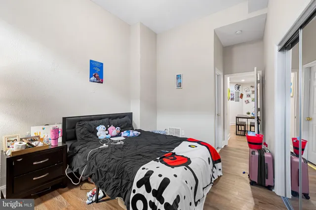 a bedroom with a bed and a closet