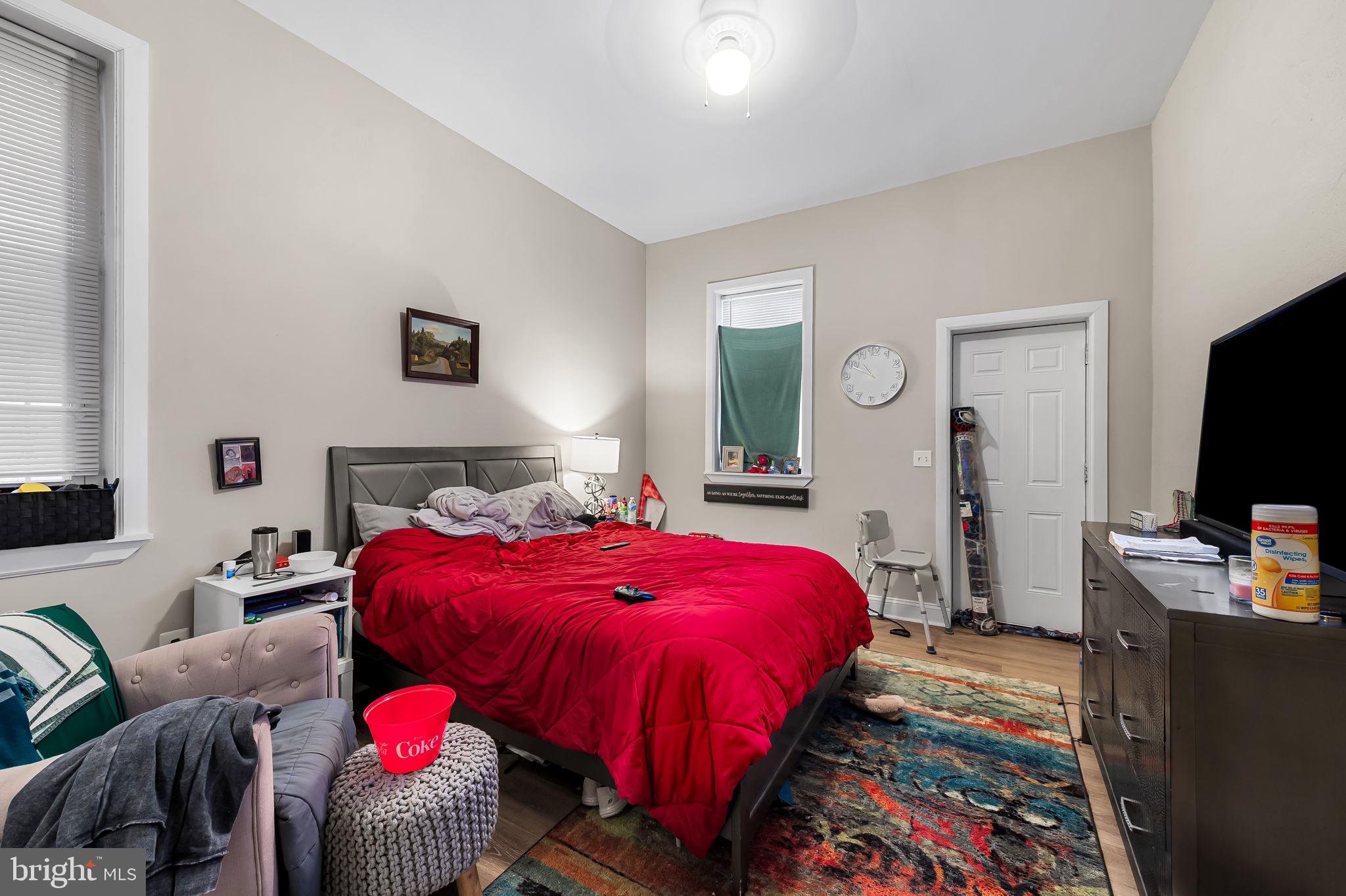 1005 Edmondson Avenue Baltimore, MD 21223 - Photo 16 of 45 a bed room with a bed and a television