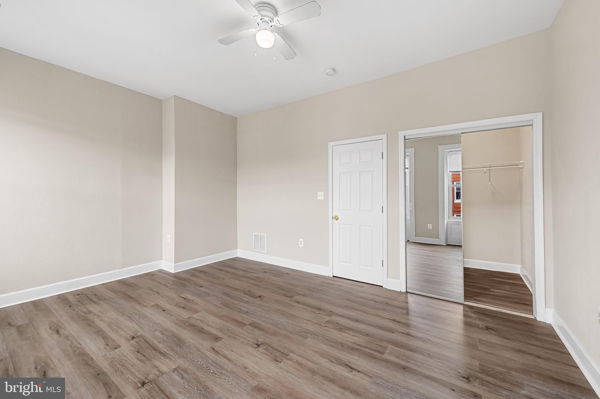 1005 Edmondson Avenue Baltimore, MD 21223 - Photo 43 of 45 a view of empty room with wooden floor