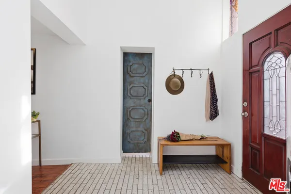 a bedroom with a bed and a lamp on table