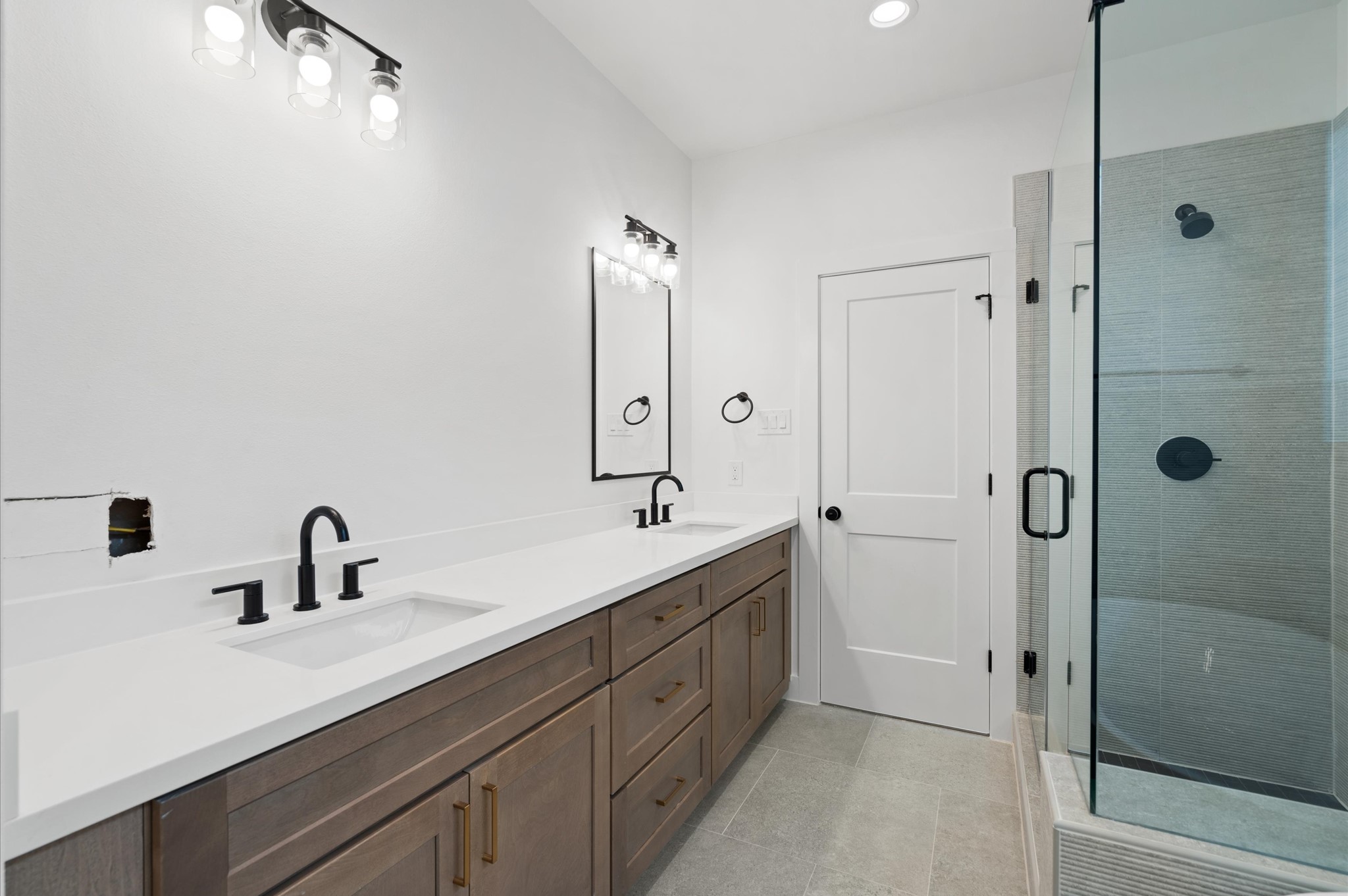 7807 Amelia Road, Unit A Houston, TX 77055 - Photo 22 of 25 Primary bath. This is the base cabinet color throughout the home. Photo is from a different floor plan.