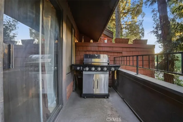 a view of balcony with furniture