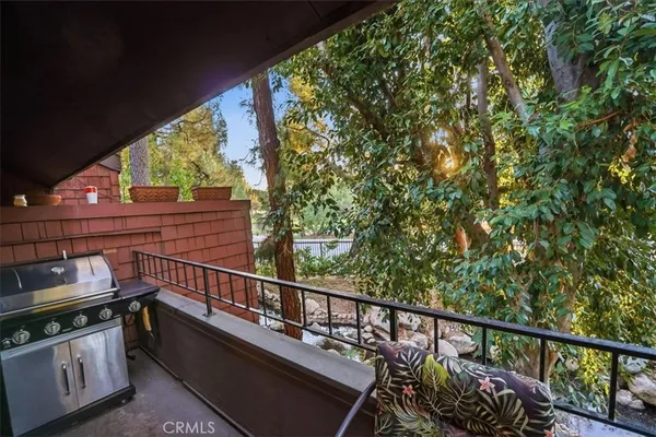 a view of a balcony with chairs