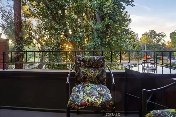 a view of a balcony with wooden floor