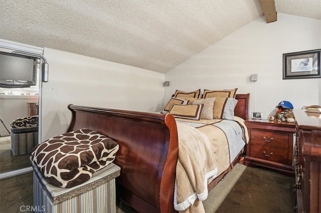 300 South Prospectors Road, Unit 29 Diamond Bar, CA 91765 - Photo 22 of 37 a bedroom with bed and a tv