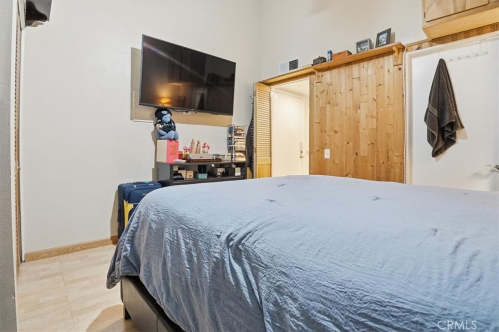 300 South Prospectors Road, Unit 29 Diamond Bar, CA 91765 - Photo 24 of 37 a bedroom with a bed a flat screen tv and dresser