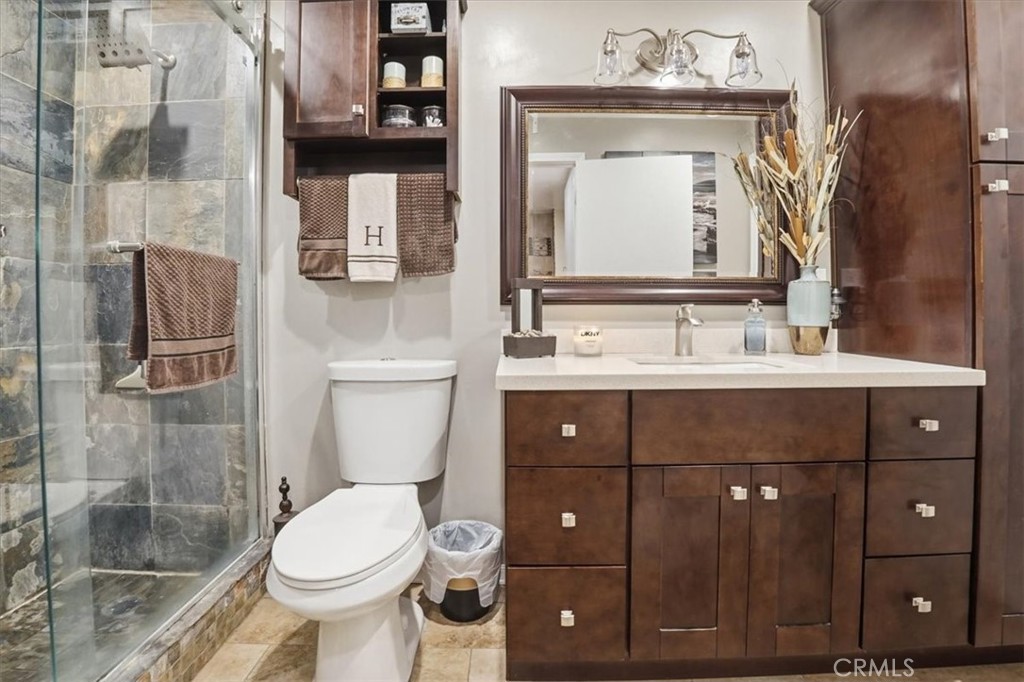 300 South Prospectors Road, Unit 29 Diamond Bar, CA 91765 - Photo 26 of 37 a bathroom with a sink vanity mirror and toilet