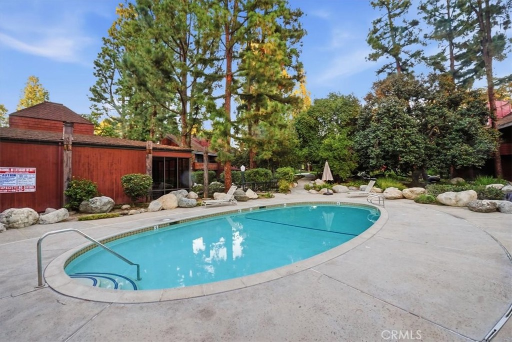 300 South Prospectors Road, Unit 29 Diamond Bar, CA 91765 - Photo 31 of 37 a view of a swimming pool with a patio