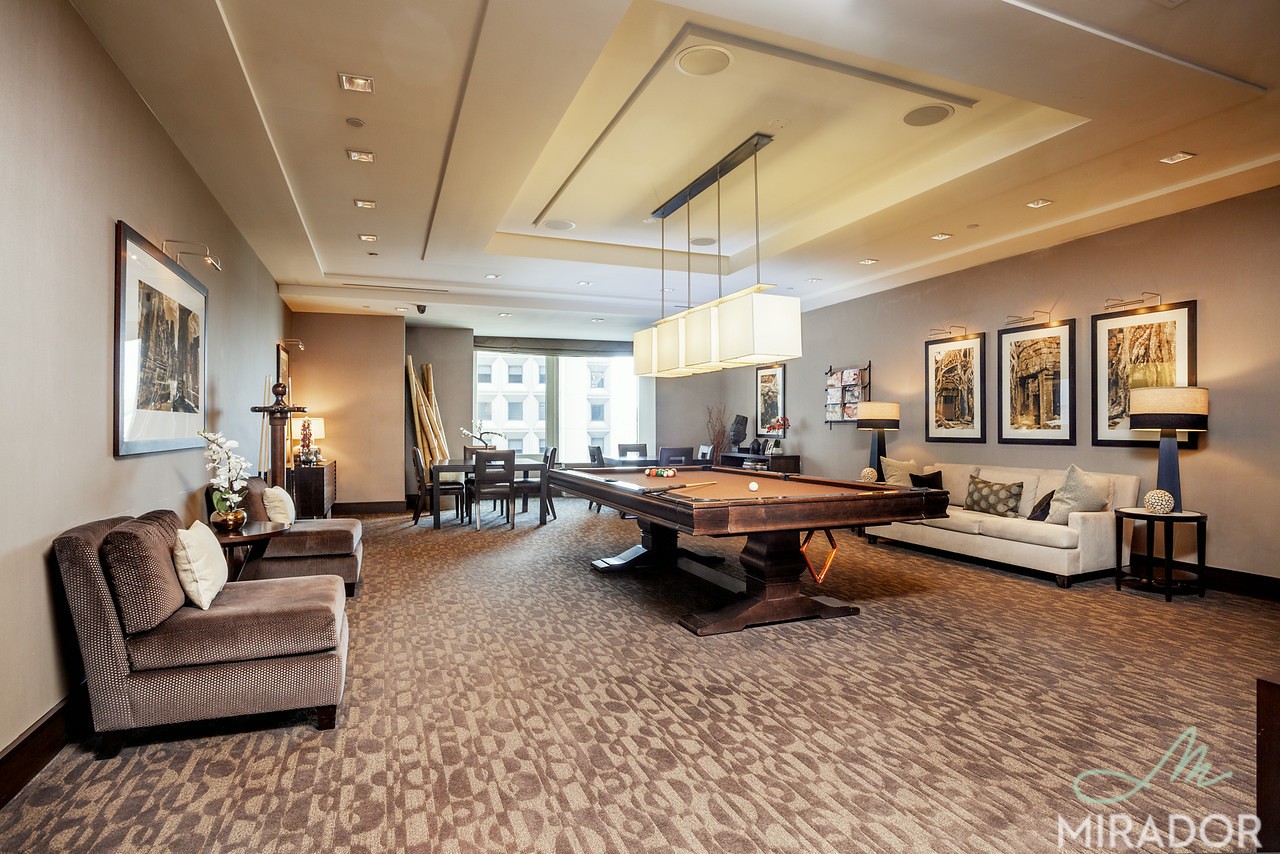 2 Water Street, Unit PHC Manhattan, NY 10004 - Photo 14 of 20 a living room with furniture and a wooden floor