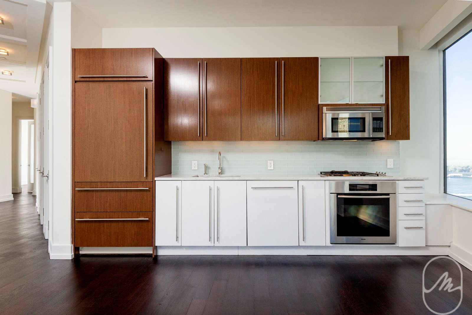 2 Water Street, Unit PHC Manhattan, NY 10004 - Photo 3 of 20 a kitchen with a refrigerator and a stove top oven