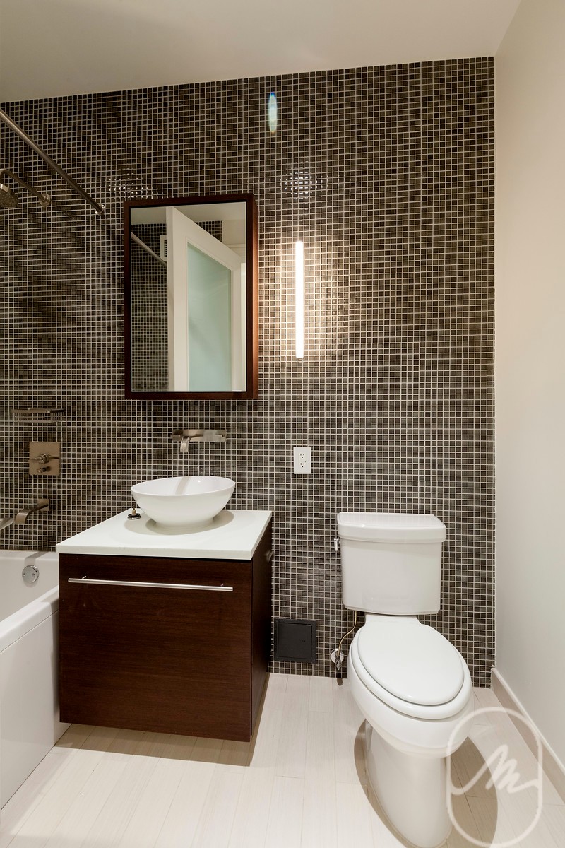 2 Water Street, Unit PHC Manhattan, NY 10004 - Photo 10 of 20 a bathroom with a sink toilet and mirror
