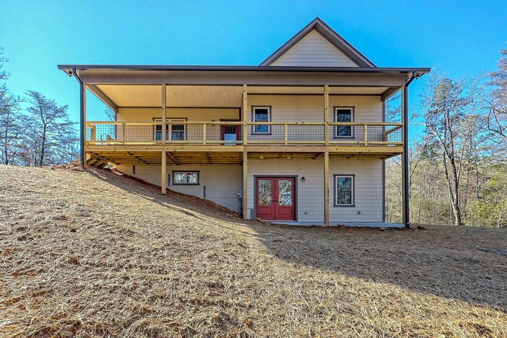 73 Cricket Lane Warne, NC 28909 - Photo 2 of 82 a front view of a house with a yard and garage