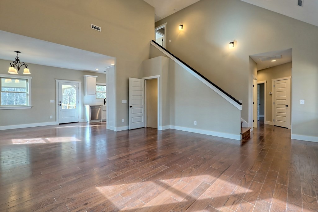 73 Cricket Lane Warne, NC 28909 - Photo 21 of 82 a view of a hallway with wooden floor and a living room