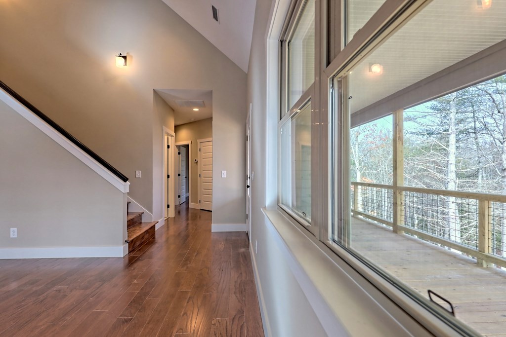 73 Cricket Lane Warne, NC 28909 - Photo 22 of 82 a view of a hallway with wooden floor and staircase
