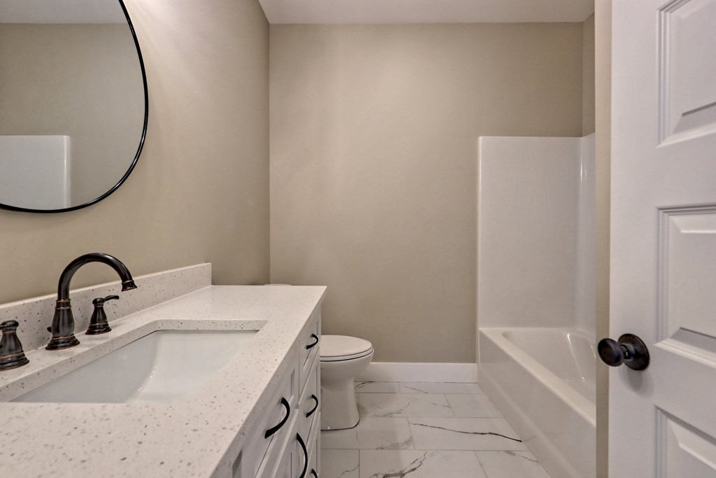 73 Cricket Lane Warne, NC 28909 - Photo 39 of 82 a bathroom with a sink toilet and mirror