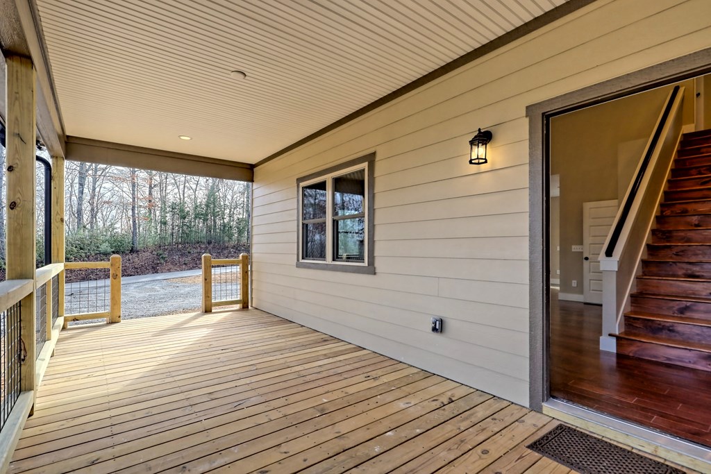 73 Cricket Lane Warne, NC 28909 - Photo 44 of 82 a view of a patio with wooden floor and floor to ceiling window
