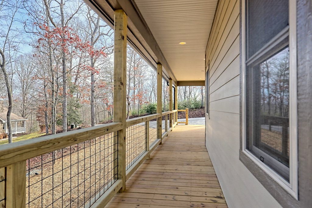 73 Cricket Lane Warne, NC 28909 - Photo 47 of 82 a view of a balcony with wooden floor and floor to ceiling window