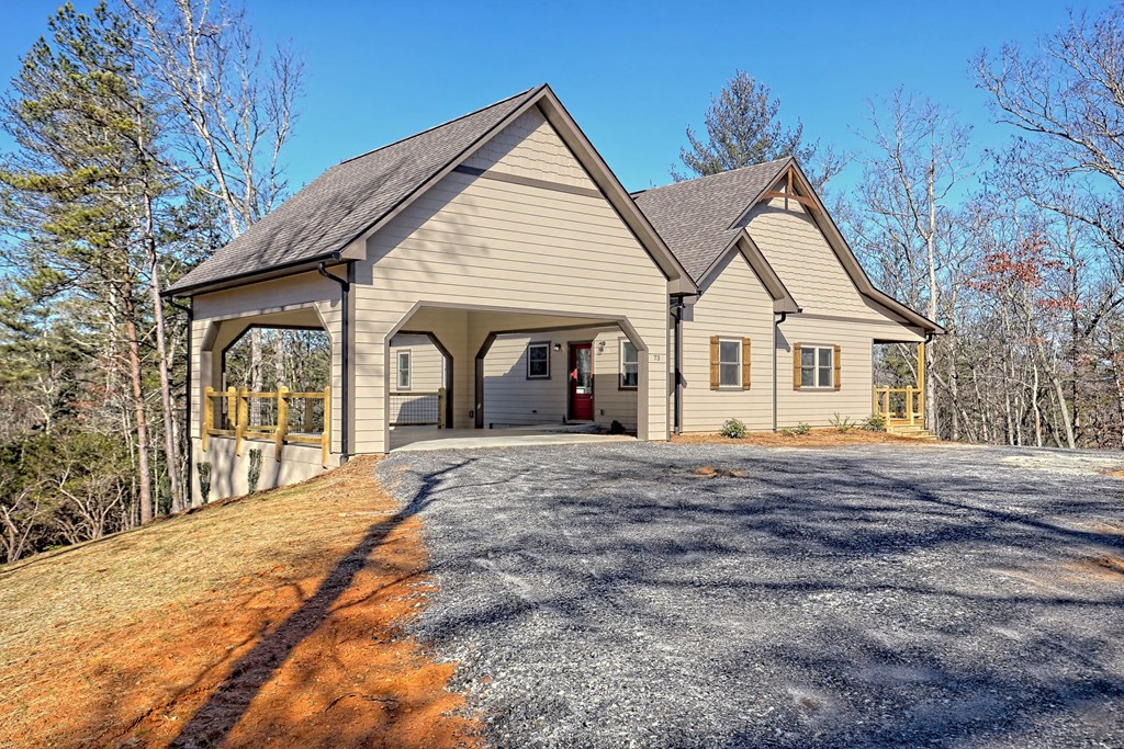 73 Cricket Lane Warne, NC 28909 - Photo 7 of 82 a view of a house with a yard and large tree
