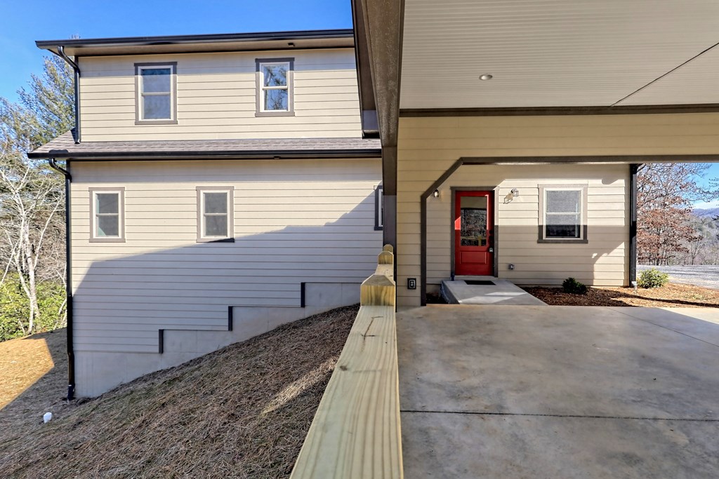 73 Cricket Lane Warne, NC 28909 - Photo 10 of 82 a view of a brick house with large windows